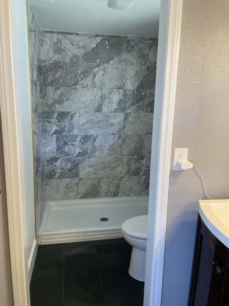 This image showcases a well-painted bathroom with a vanity, highlighting the quality of interior painting services in Riverside, CA.