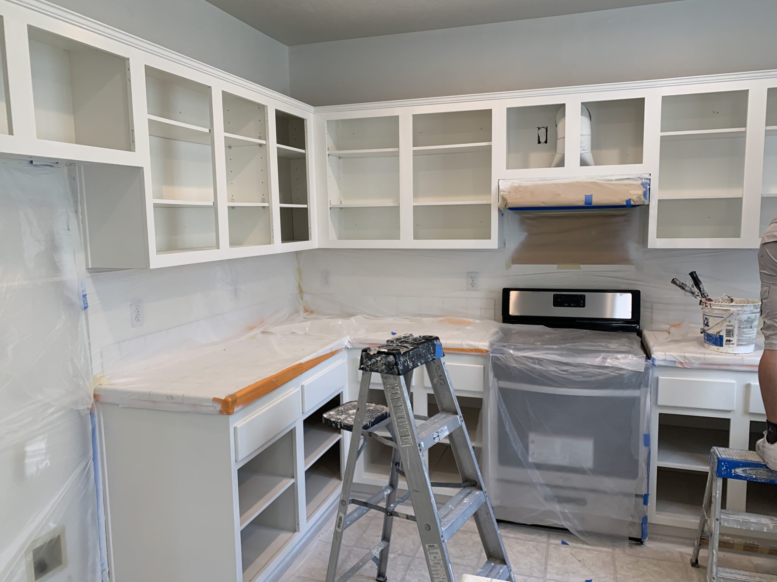 Kitchen cabinets refinished with a clean white paint finish