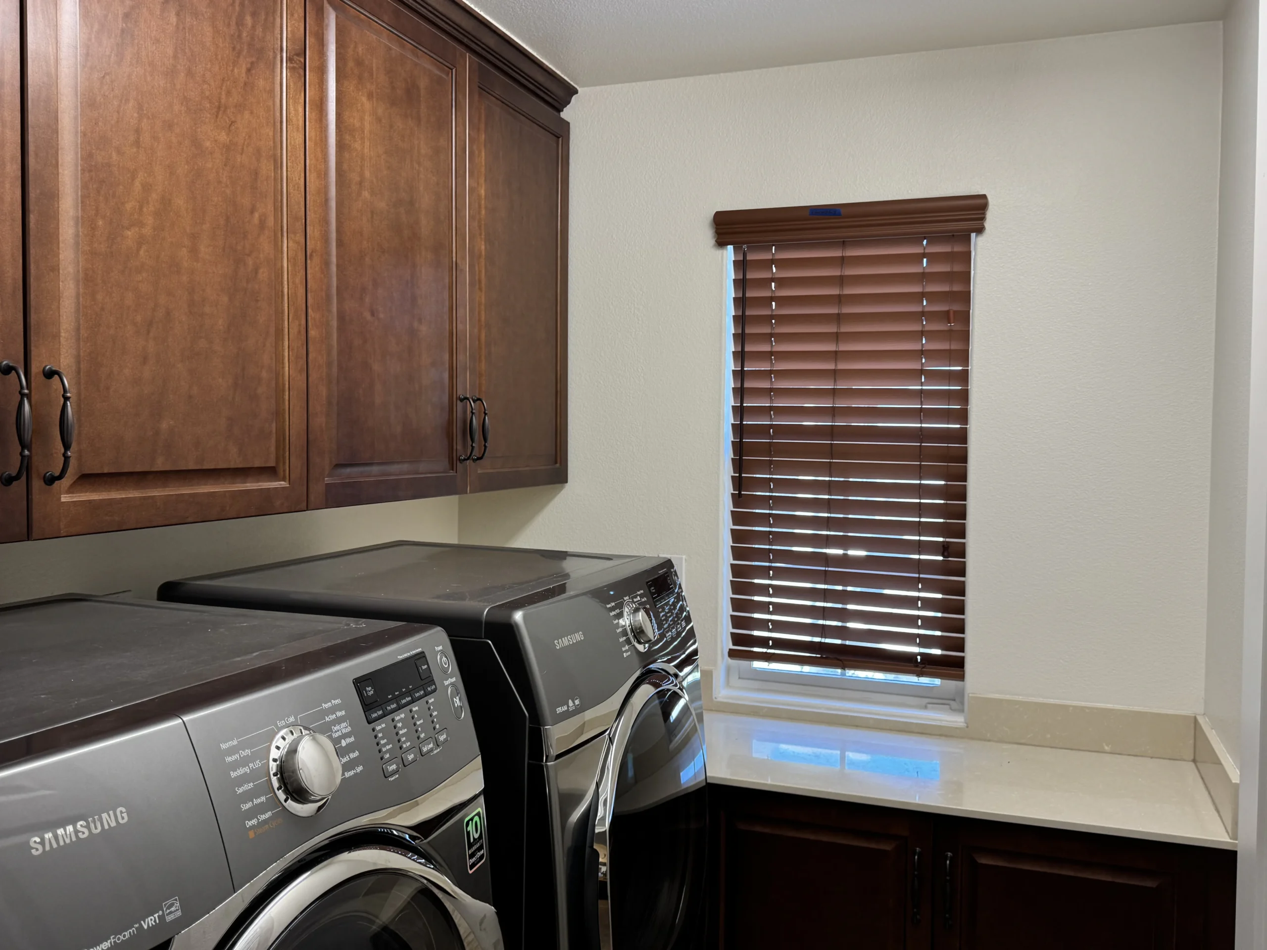Kitchen with dark wood cabinets and stainless steel appliances