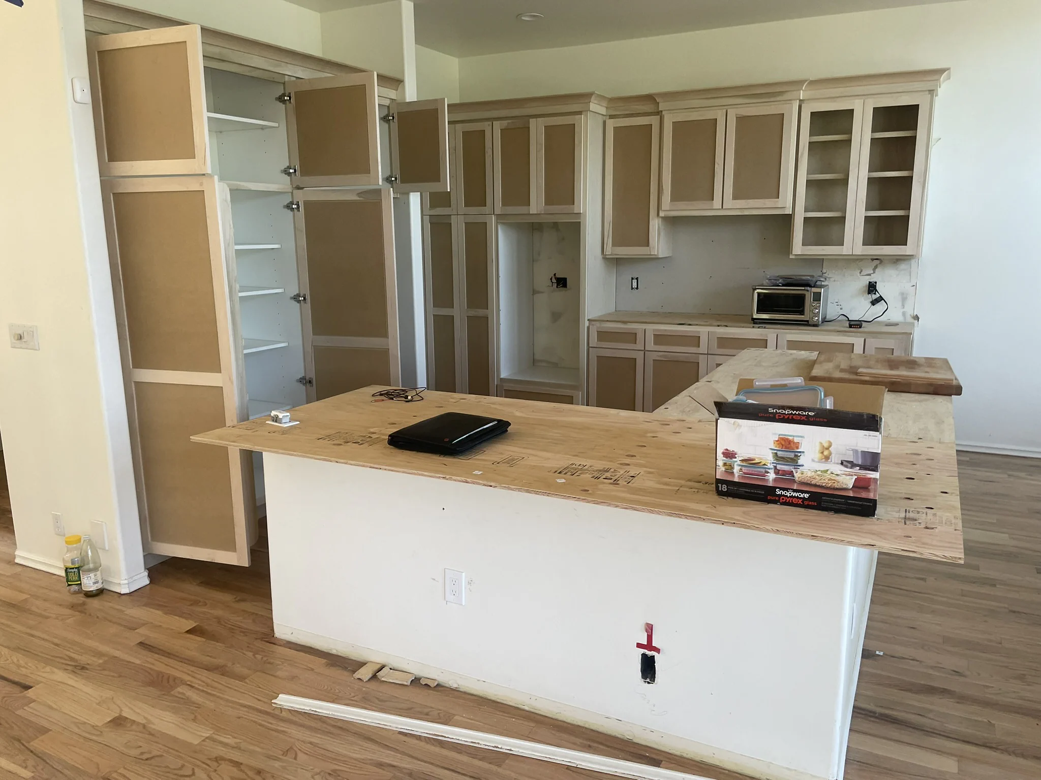 Kitchen cabinets and island prepared for professional refinishing